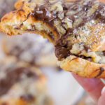 Chocolate Chip Cookie Croissant Bite Out in Hand Melty Chocolate