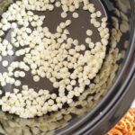 Crockpot Candy adding white baking chips to crockpot