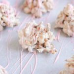 Crockpot Candy drizzled with pink chocolate almond bark