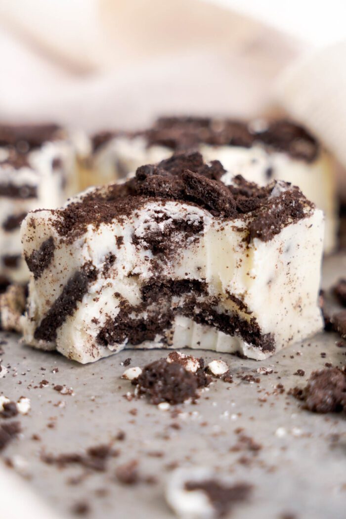 A close-up of Oreo fudge with crushed cookie pieces.