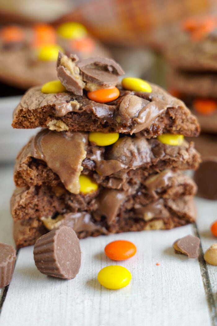 Stack of chocolate chip cookies with colorful candy pieces.