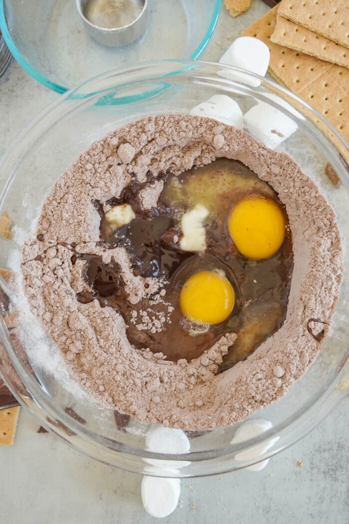 S'mores Brownie Mix Cookies adding wet ingredients to bowl