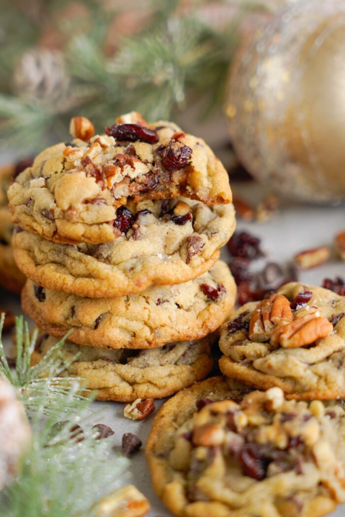 Stack of cookies with pecans and dried cranberries.