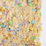 Easter Cake Mix Cookie Bars dough in baking dish