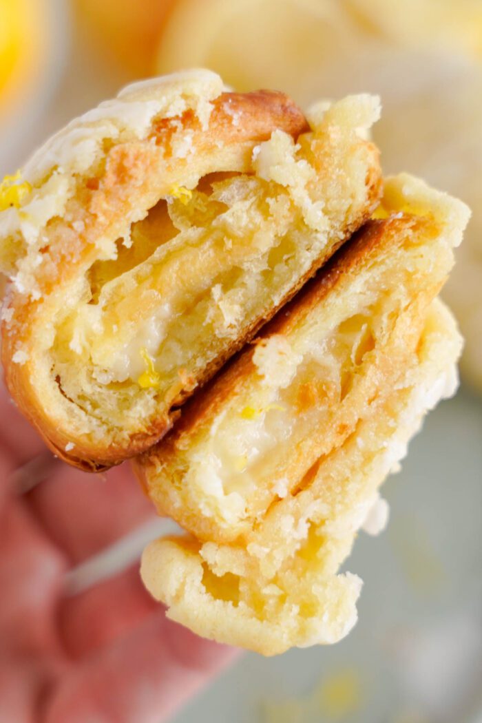 Close-up of a split lemon crookie featuring a flaky golden crust.